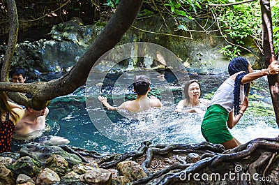 Unidentified people playing around hot spring