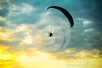 Unidentified skydiver, parachutist on blue sky