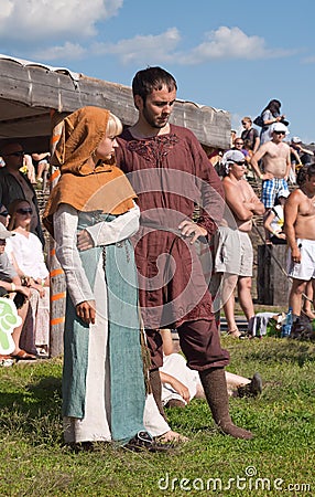 Unidentified young couple in medieval clothes at a historical re