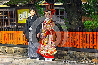 Unidentified young Japanese couple dressed in formal kimono.