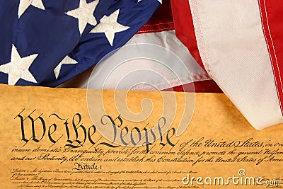 United States Constitution and Flag -- Landscape Orientation with Flag draped over document