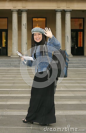 University - Student waving to fellow students