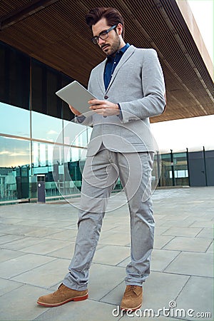 Urban business man with laptop outside in airport