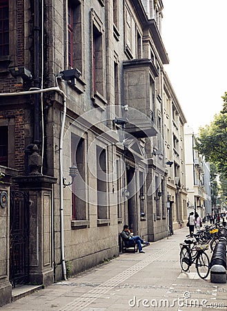Urban street sidewalk with buildings, roadside of city street, street view of China