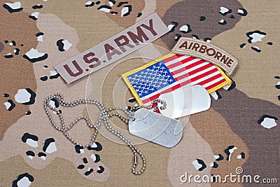 US ARMY airborne tab with blank dog tags on camouflage uniform