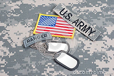 US ARMY ranger tab with blank dog tags on camouflage uniform