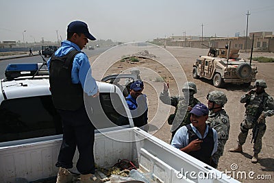 US Army Soldiers check Iaqi Police at Checkpoint
