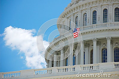 US Capitol in Washington DC detail with flag