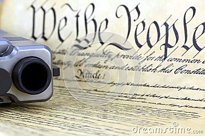 US Constitution with Hand Gun