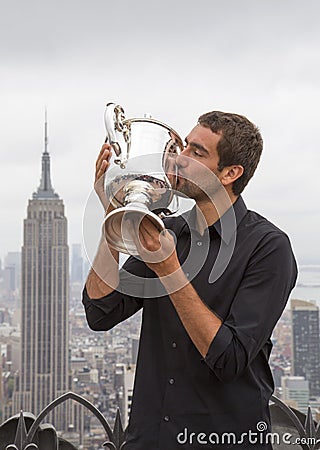 US Open 2014 champion Marin Cilic posing with US Open trophy on the Top of the Rock Observation Deck at Rockefeller Center