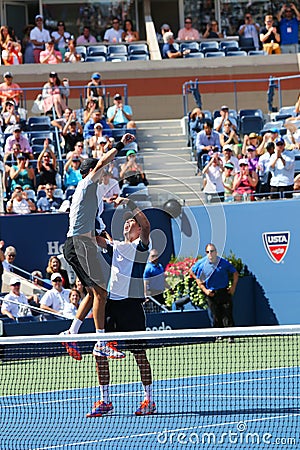 US Open 2014 men doubles champions Bob and Mike Bryan celebrate final match victory at Billie Jean King National Tennis Center