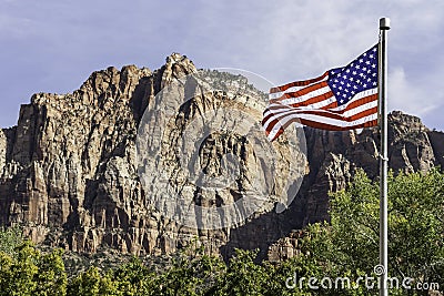 USA flag in front of mountains