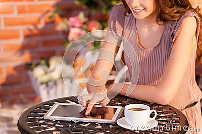 Using her brand new tablet in cafe.