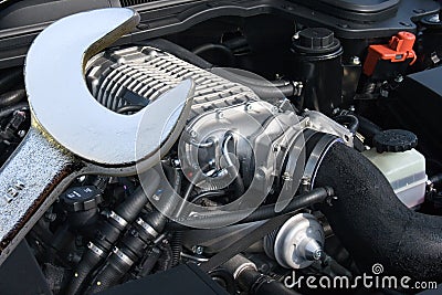 V8 supercharged car engine and spanner