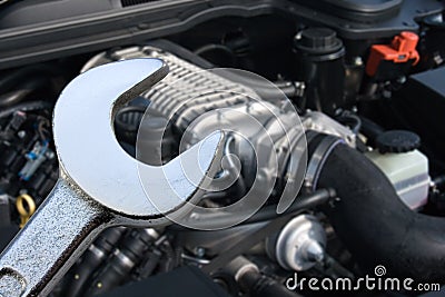 V8 Supercharged car engine and spanner