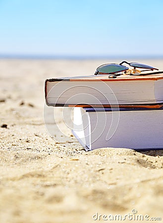 Vacation Beach with Books in Sand