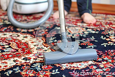 Vacuuming the carpet