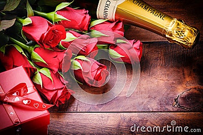 Valentine s setting with red roses, champagne and gift