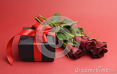 Valentines Day black box with red ribbon gift and red rose