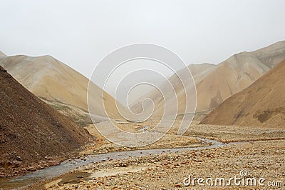 Valley among deserted hills during the sand storm, Iceland