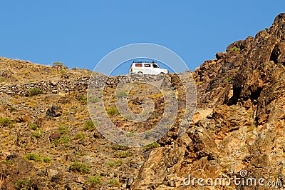 Van driving on high mountain road