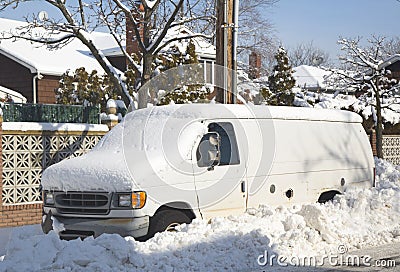 Van under snow in Brooklyn after massive winter storms strikes Northeast