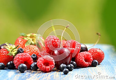 Variety of soft fruits, strawberries, raspberries, cherries, blueberries on table