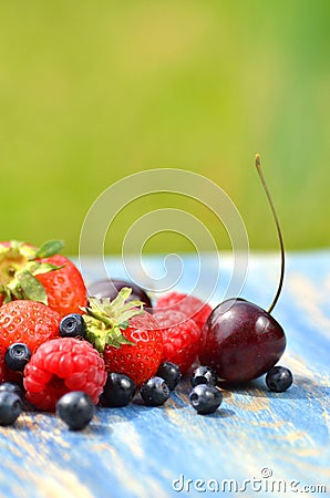 Variety of soft fruits, strawberries, raspberries, cherries, blueberries on table