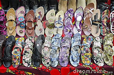 Various colorful shoes in India market