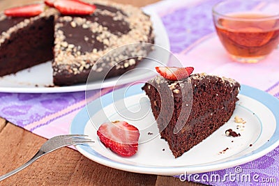 Vegan chocolate cake with almonds and strawberry. Lenten dish