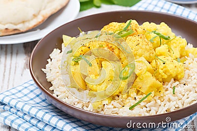Vegetable curry with cauliflower and rice on the plate