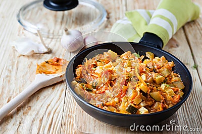 Vegetable stew with courgettes in a frying pan