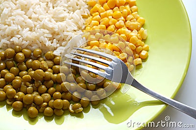 Vegetarian food: rice, green peas and corn