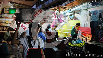 Vendor Carries Food on Head