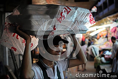 Vendor Carries Food on Head