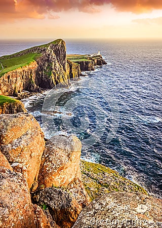 Vertical view of Neist Point lighthouse with rocks foreground, S