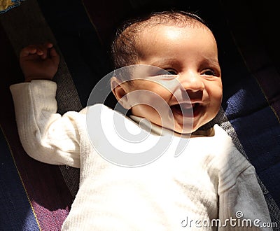 Very Happy asian baby girl in white winter dress