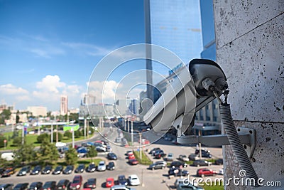 Video surveillance camera on a wall