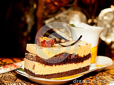 Vienna cake with almond and caramel at dark background