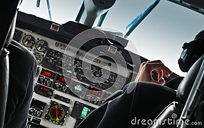 View of airplane cockpit and pilot
