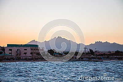 View of the beach, hotels and mountains in the distance