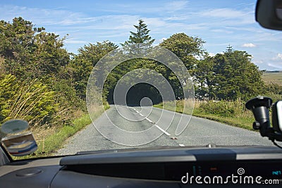 View of an open road from driving a car