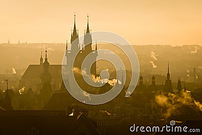 View of Prague city towers in misty morning sunrise