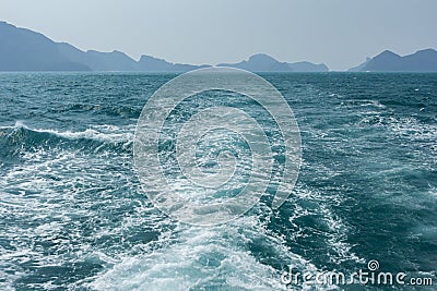 View of waves behind a boat