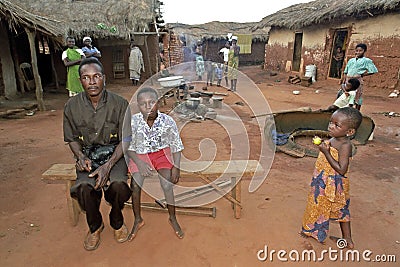 Village life in Ghana with women, father and son