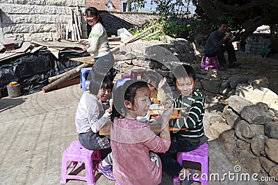 Villagers happily eating lunch under the awnings