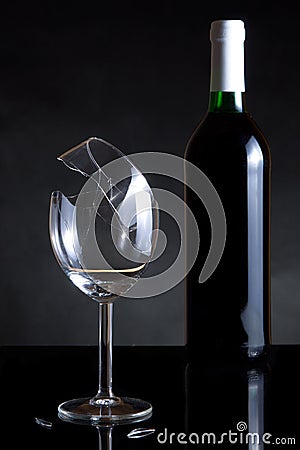 Vine bottle and broken glass