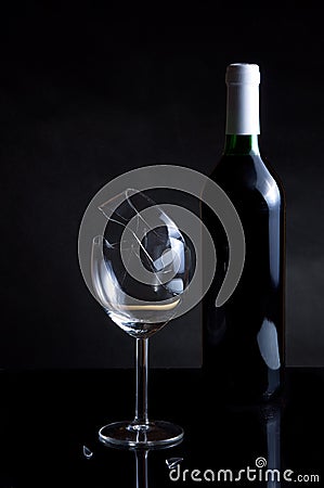 Vine bottle and broken glass