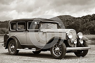 Vintage Antique Automobile Traveling on Dirt Road
