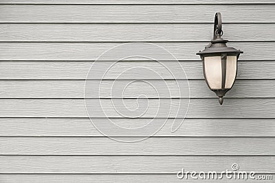 Vintage Antique wall lamp on grey wood wall, for background with